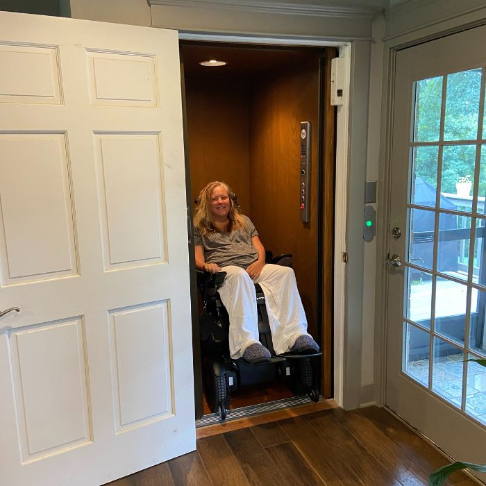 Person with ALS using elevator in her home