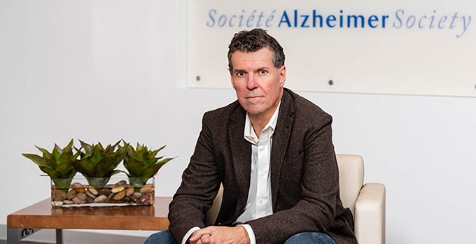 Dave Spedding, the Chief Executive Officer of the Alzheimer Society of Toronto, sitting.
