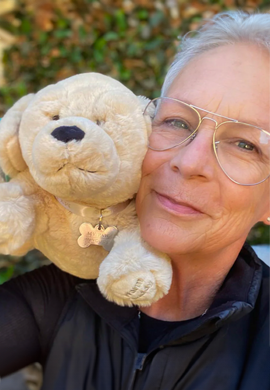 Jamie Lee Curtis with one of the My Paw in Yours stuffed animal toy.