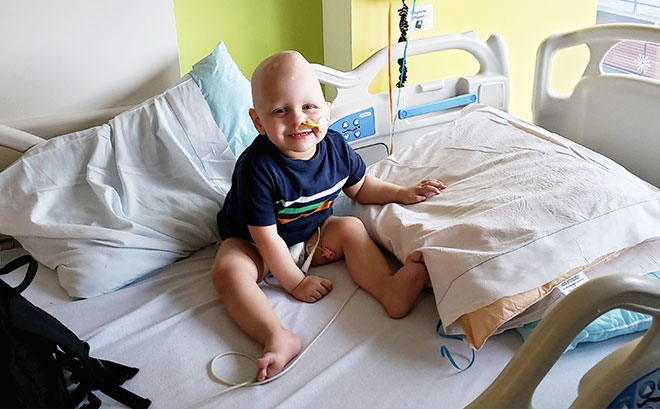 Dana-Farber's Jimmy Fund Clinic patient, Conor, sitting in bed