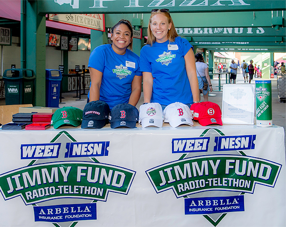 Volunteers sell hats to Jimmy Fund supporters