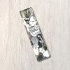 Clear epoxy resin mezuzah cover with silver shapes 