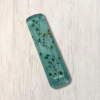 Light turquoise resin mezuzah cover with delicate white baby's breath flowers