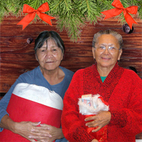 Photo of Elders holding their holiday stockings